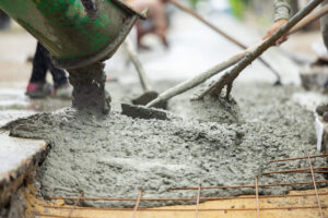 Concrete contractors finishing concrete.